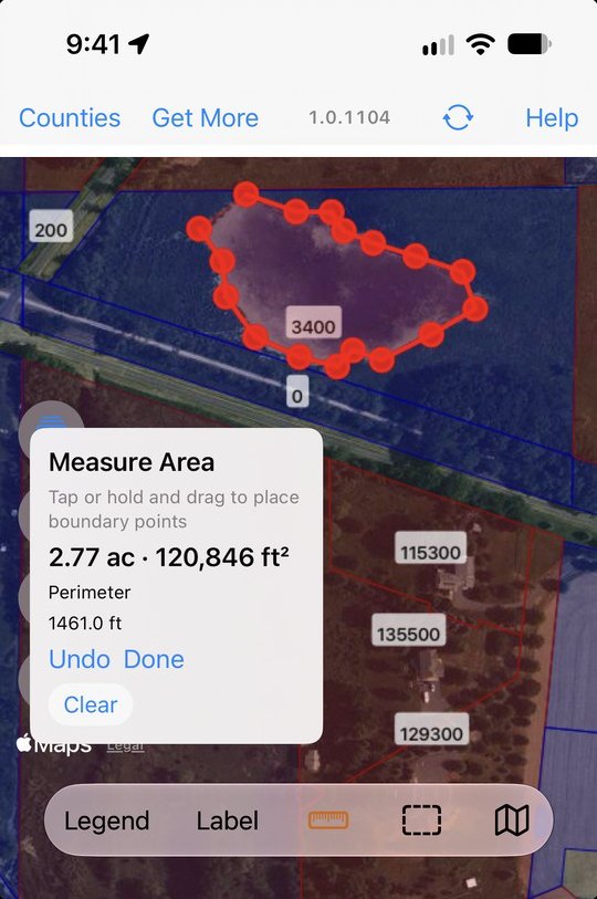 The Measure Area tool in WI 2026 tracing the edge of a pond, reporting 2.77 acres, 120,846 square feet, and a perimeter of 1,461 feet over aerial imagery